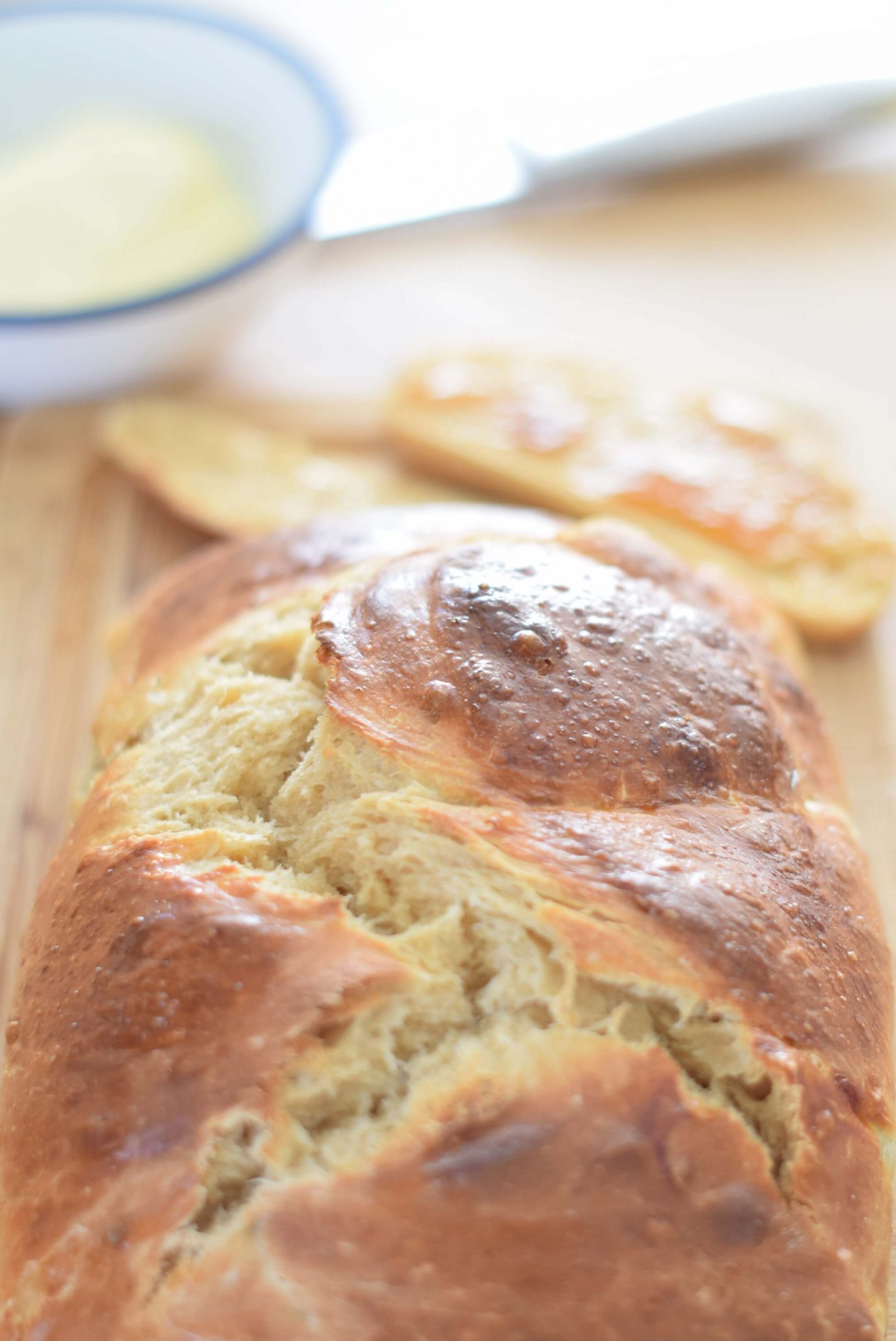 A freshly baked sourdough braided brioche bread