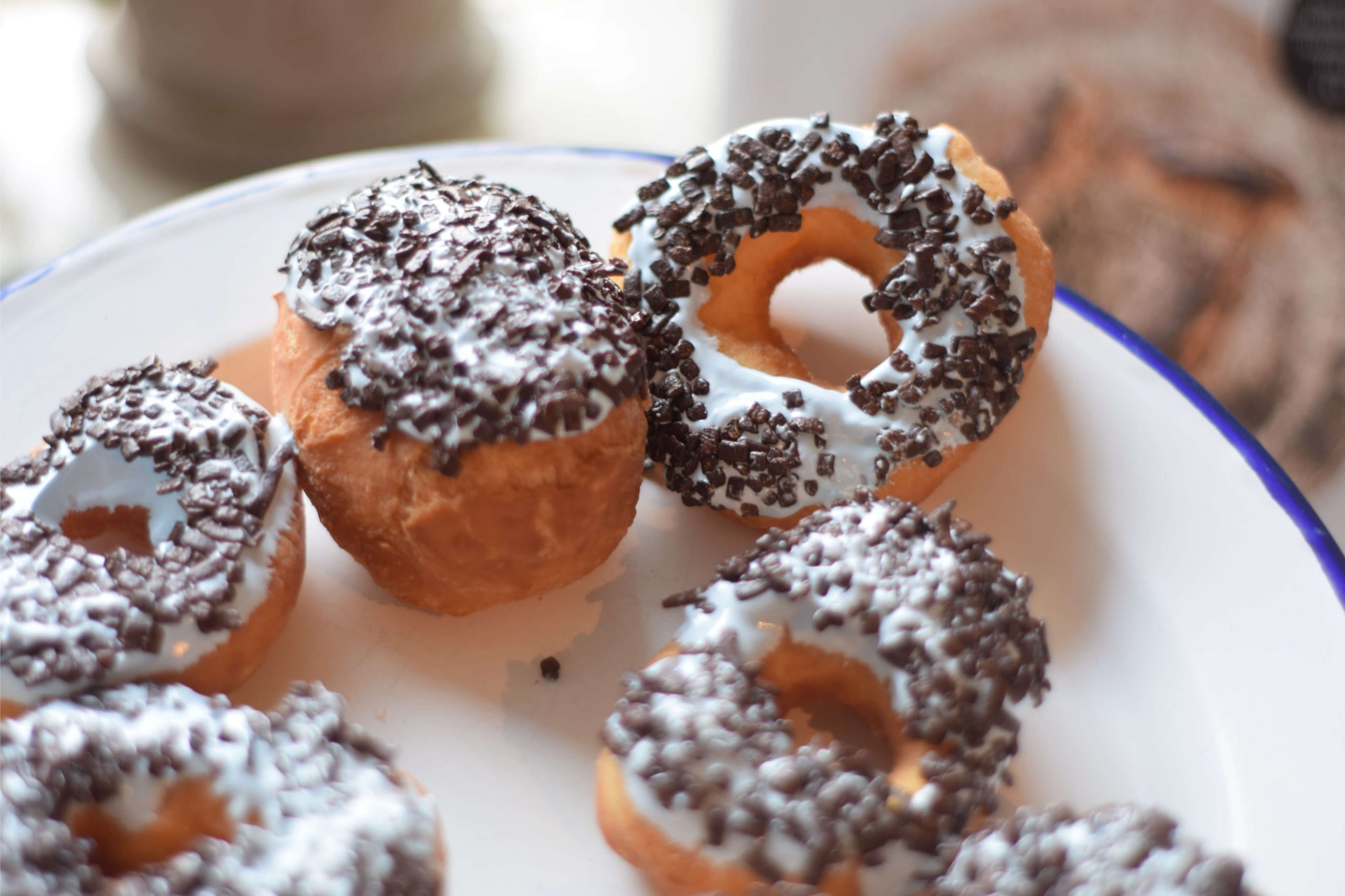 Sourdough doughnuts with cream cheese frosting and chocolate sprinkels