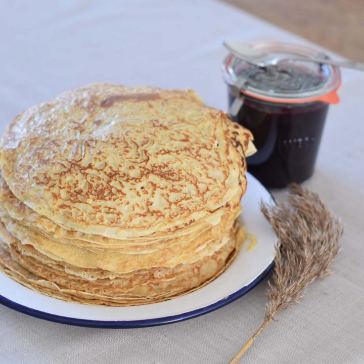 Einkorn Pancakes with a jar of blueberry jam