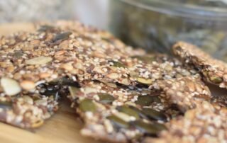 Seed Crackers on a bamboo board.